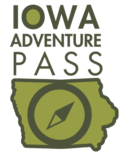 Logo for the Iowa Adventure Pass featuring stylized text above an outline of Iowa with a compass symbol inside, all in green tones.
